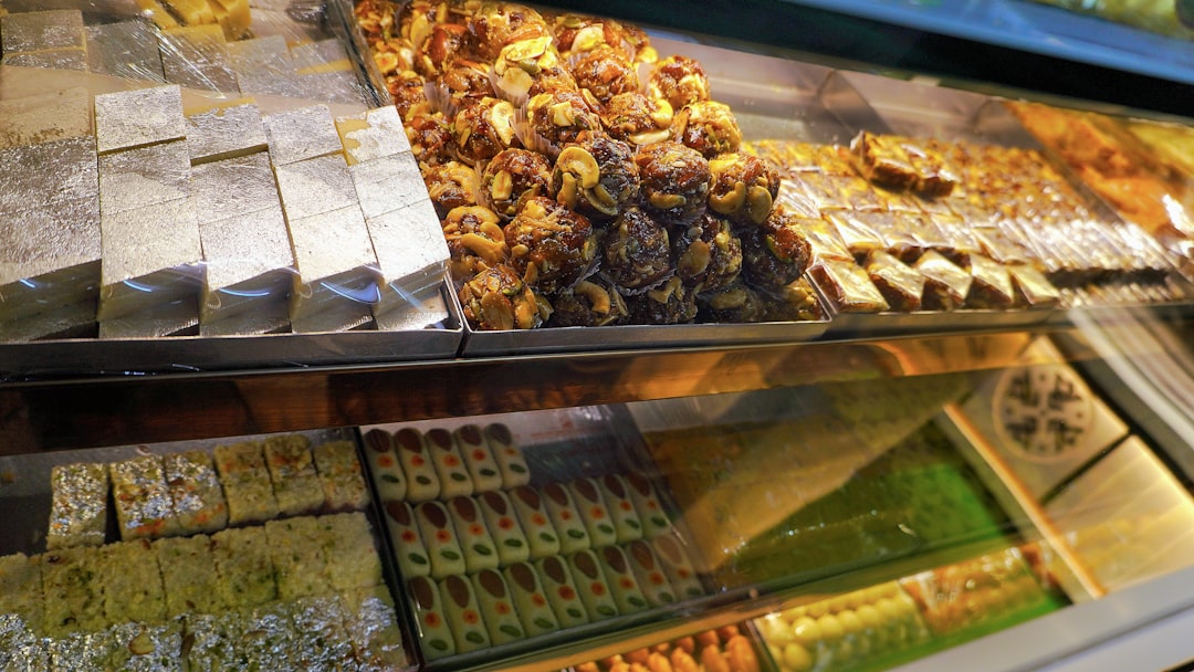 A display case filled with various delicious pastries and sweets